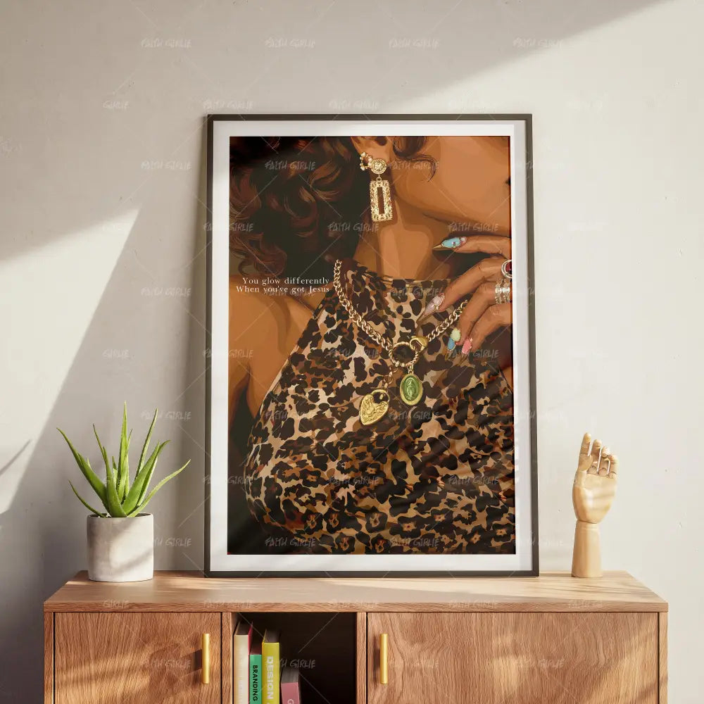 Glowdifferently Christian confidence wall art by Faith Girlie featuring a stylish woman in leopard print with gold jewelry and the message “You glow differently when you've got Jesus.”